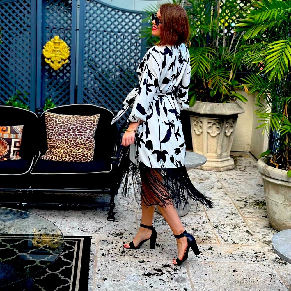 Super chic tassel wrap style dress. A total show stopper